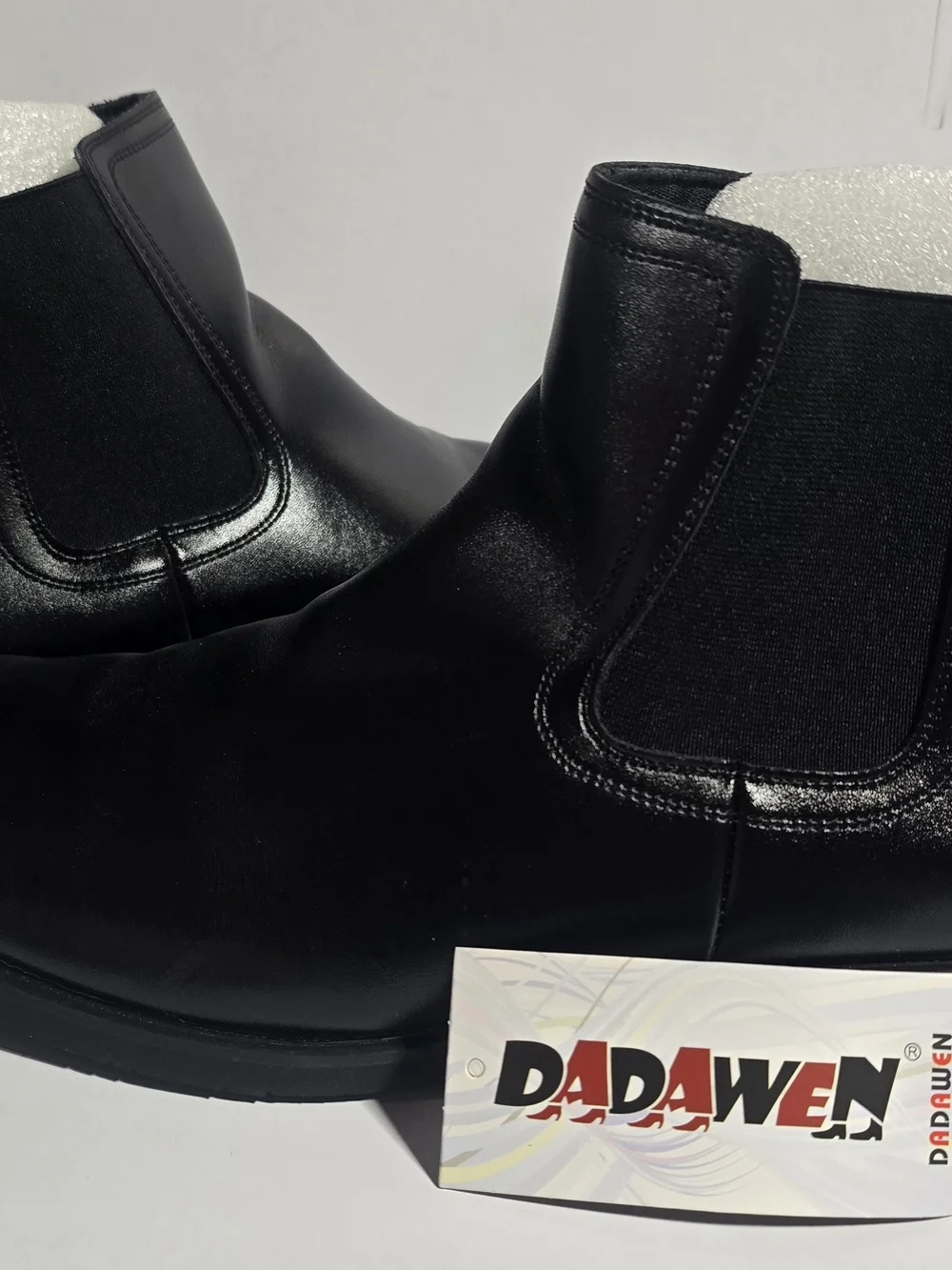 DADAWEN Men's Chelsea Boots in black, featuring smooth synthetic leather uppers